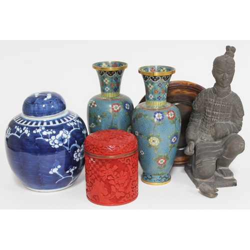 413 - A mixed lot of Chinese items comprising a terracotta warrior height 23cm, a wood stand, a pair of cl... 