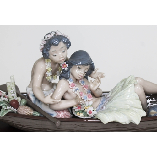 418 - A Lladro Galanteo Hawaiano Lover's Paradise figure Ref. 05779 with wooden plinth, length 42cm.