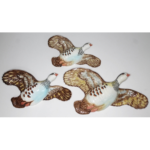 480 - A set of three Beswick flying red legged partridges, nos. 1188-1, 1188-2 & 1188-3.