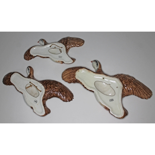 480 - A set of three Beswick flying red legged partridges, nos. 1188-1, 1188-2 & 1188-3.