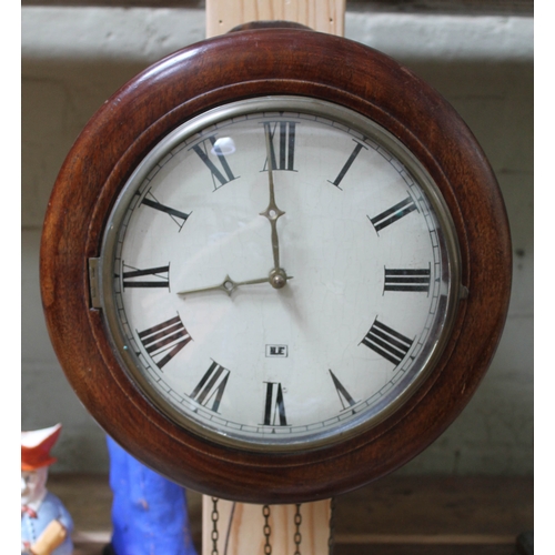 64 - A Victorian mahogany wall clock with striking movement with pendulum and weights.