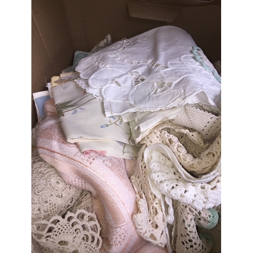 126 - A box of linen to include macrame, doilies, etc.