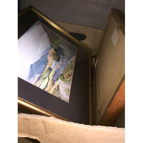 128 - A box of paintings and prints.