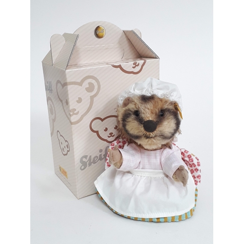 521 - A Steiff Mrs Tiggy-Winkle with ear tag numbered 354762, tags an box.