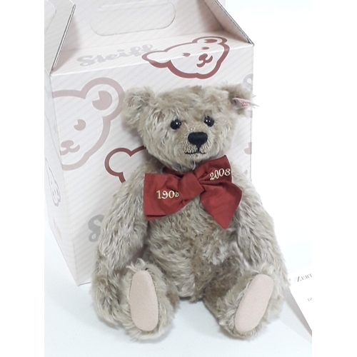 522 - A Steiff 1908-2008 growler teddy bear numbered 037221 with ear tag, labels, box and paper bag.