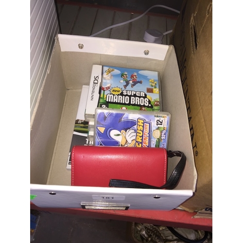 181 - A Nintendo DS with games.