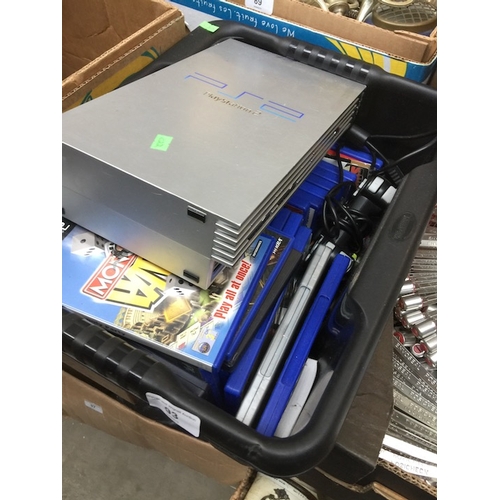 93 - A box containing a PS2 console, controller and quantity of games.