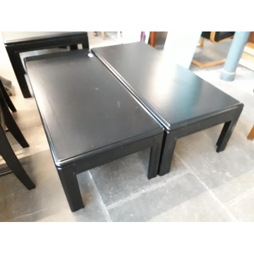 961 - Two rectangular black painted coffee tables