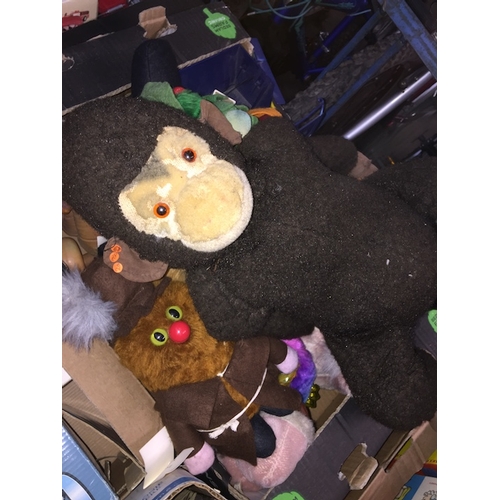 75 - A box of soft toys and rubber to include Furbys, Merrythought monkey, etc.