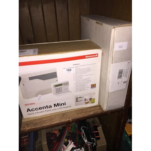 102 - A Honeywell alarm system with wall mounting keypad