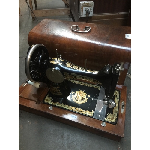 108 - A Frister & Rossman hand crank sewing machine with case.