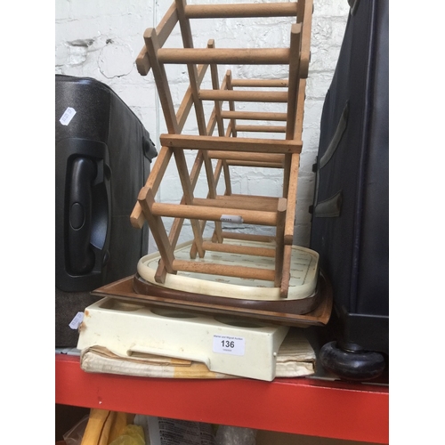 136 - Quantity of various trays and a wooden bottle rack