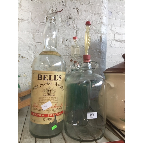 173 - 2 demijohns and 1 gallon empty whiskey bottle