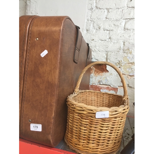 179 - A Revalation suitcase and a wicker basket