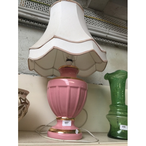 557 - A pink table lamp with cream shade