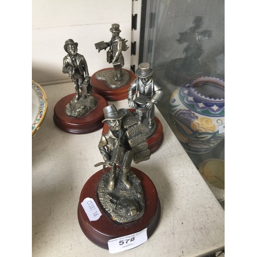 578 - 4 pewter figurines including pie seller and sweep