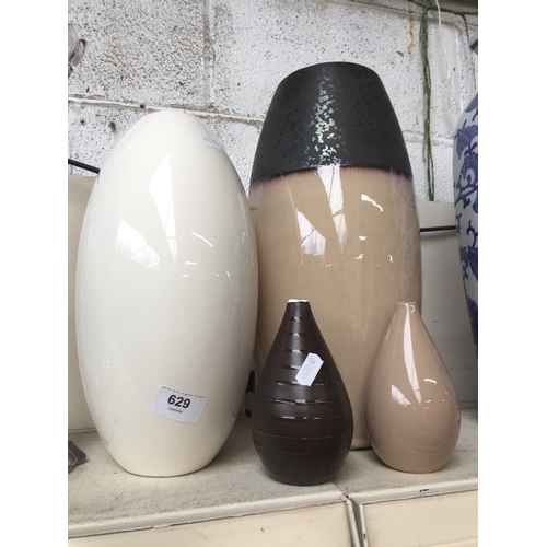 629 - 4 Assorted pottery vases