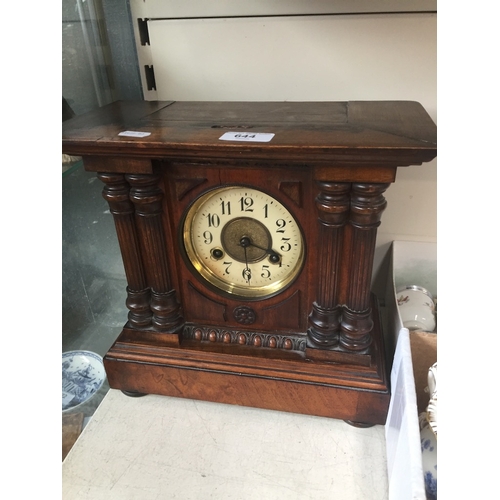 644 - A 19th century walnut mantle clock.