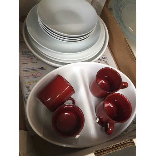 671 - A box of white tableware and some red mugs