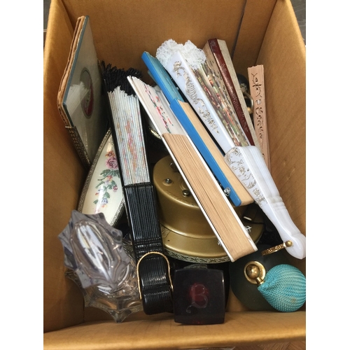 693 - A box of scent bottles, filigree vanity items + fans.