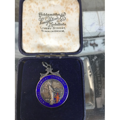 697 - A cased silver long service medal presented by Imperial Chemical Industries Ltd