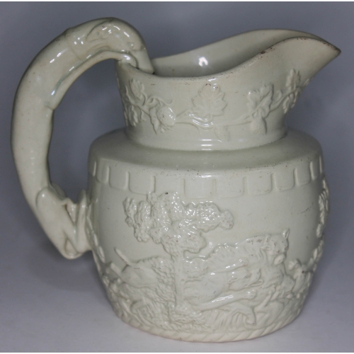 326 - A 19th century white salt glazed jug decorated all over with hunting scene, height 16cm.