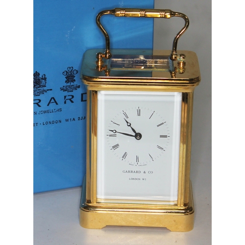 333 - A modern Garrard & Co brass carriage clock with box.