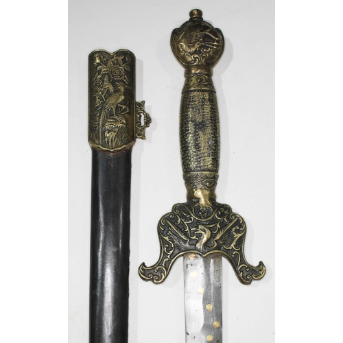 345 - A Boxer Rebellion style Chinese sword and scabbard with gilt brass relief decoration.