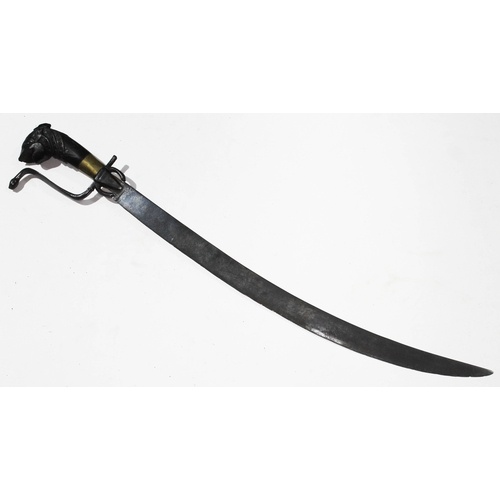 360 - An eastern short sword, single edged curved blade, length 58cm, wrought metal cobra hilt and carved ... 