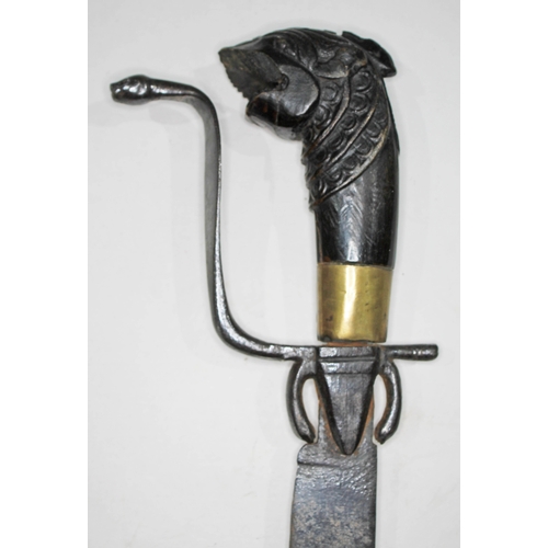 360 - An eastern short sword, single edged curved blade, length 58cm, wrought metal cobra hilt and carved ... 