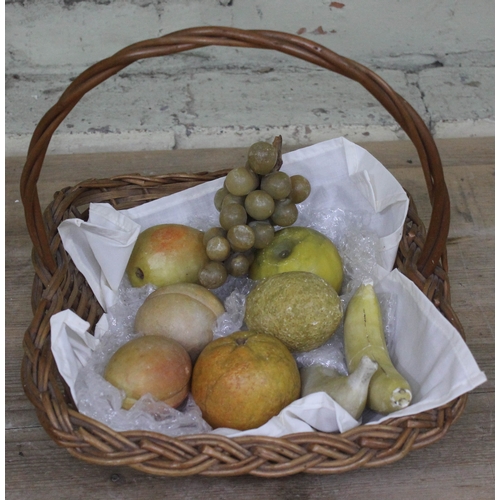 392 - A basket of Italian stained alabaster fruit comprising two bananas, lemon, orange, apple, pear, two ... 