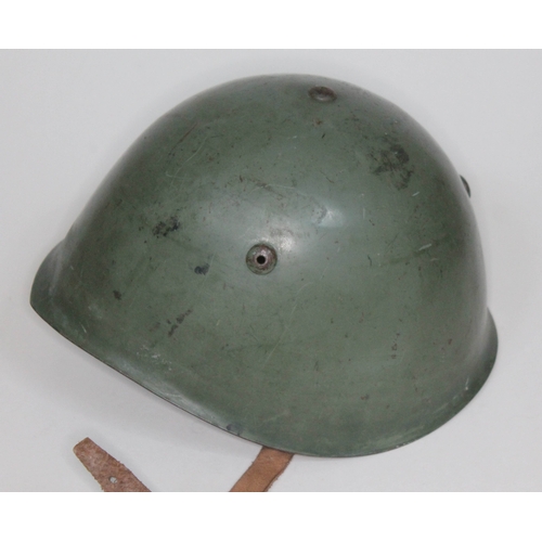 376 - An Italian WWII helmet with leather liner inscribed 'Marzelli 1938'.