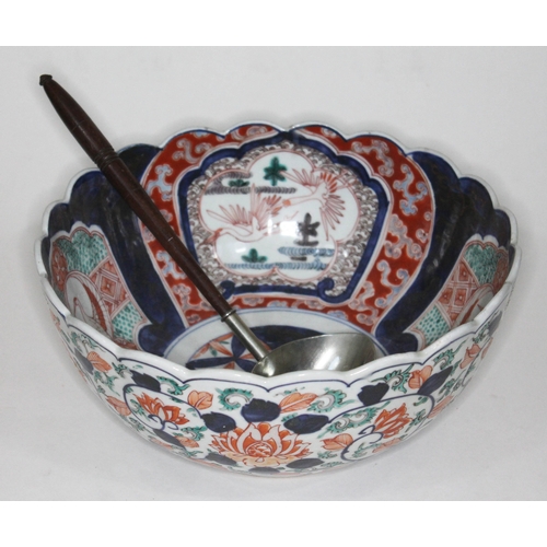 386 - A 19th century Japanese Imari bowl, diam. 27.5cm, and silver plated punch ladle with turned wooden h... 