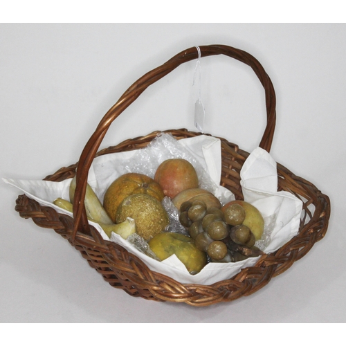 392 - A basket of Italian stained alabaster fruit comprising two bananas, lemon, orange, apple, pear, two ... 