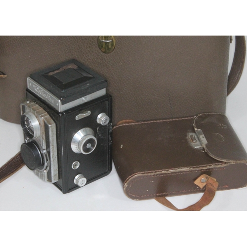 394 - A Weltaflex medium format camera together with a Ross Ensign.