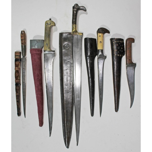 354 - A collection of five Afghan knives and sheaths.