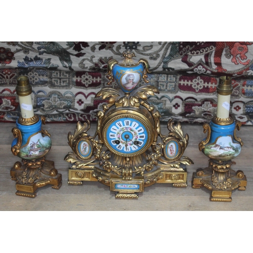 403 - A French gilt metal clock garniture with Sevres porcelain dial and panels.