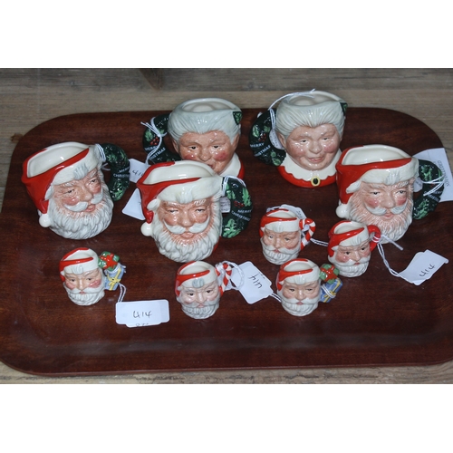 414 - A group of ten small Royal Doulton christmas related character jugs - 3 x Santa Claus D6900, 2 x Mrs... 