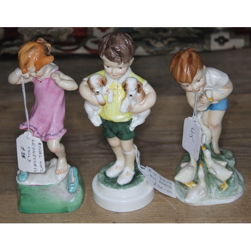 415 - A group of three Royal Worcester figures - Wednesday's Child is Full of Woe 3259, All Mine 3519, and... 