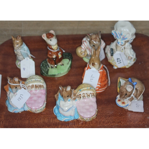 421 - A group of eight Beswick figures including 2 x Hunca Munca, Appley Dapply, Johnny Town Mouse, Lady M... 