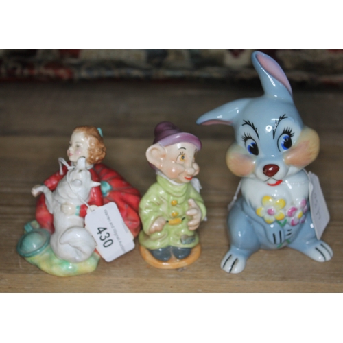 430 - A group of three figures - Royal Doulton Home Again HN 2167, Wade Disney Rabbit, and Beswick Dopey (... 