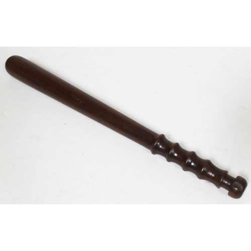 192 - A lignum vitae police truncheon, length 42cm.