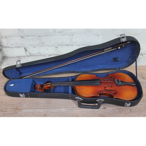 299 - An early 20th century student violin, length of back 37.5cm, with hard case and bow.