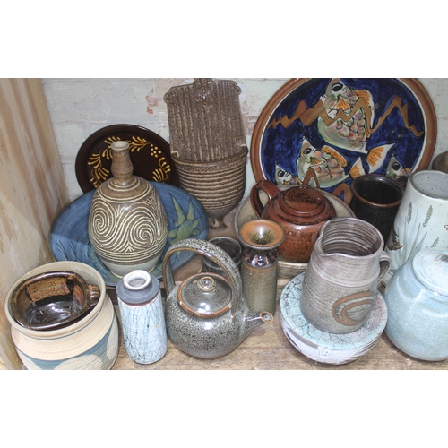 199 - A shelf of approx. 40 pieces of mainly studio pottery, various potters and studios.