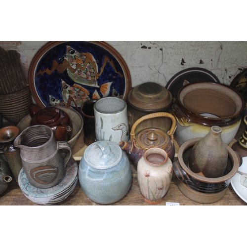 199 - A shelf of approx. 40 pieces of mainly studio pottery, various potters and studios.