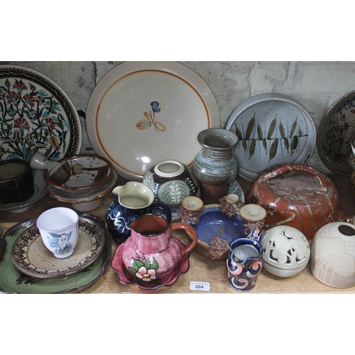 204 - A shelf of mainly studio pottery, various potters and studios, approx. 44 pieces.