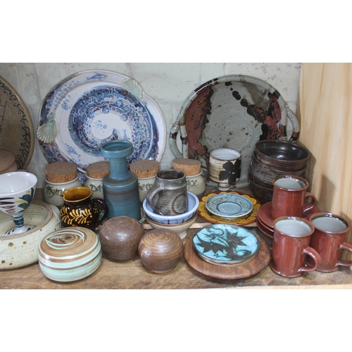 205 - A shelf of mainly studio pottery, various potters and studios, approx. 50 pieces.