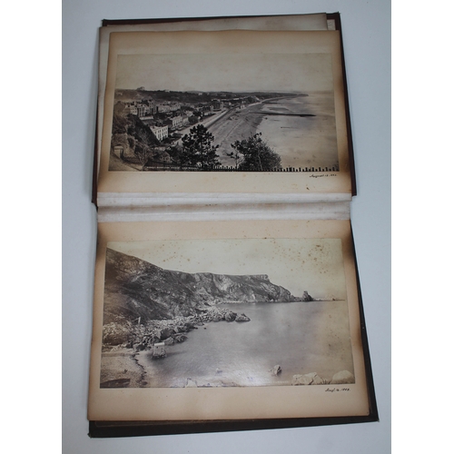 255 - A Victorian album containing approx. 28 annotated scenic photographs, various tourist destinations, ... 