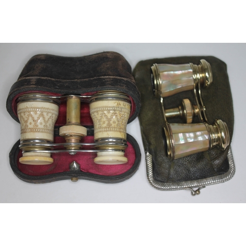 265 - A pair of carved bone opera glasses with leather case and a pair of mother of pearl and brass opera ... 