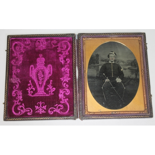 267 - A Victorian ambrotype depicting a soldier within leather case, image approx. 7cm x 9.5cm.